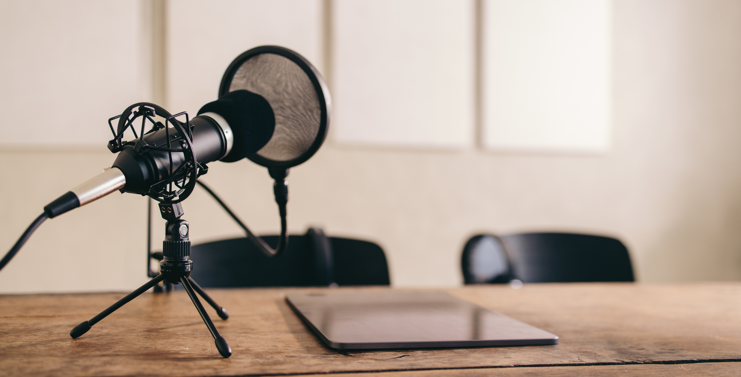 Podcast recording equipment set in a home studio.